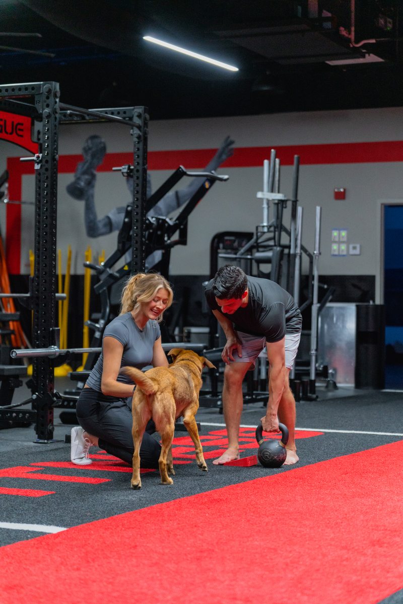Dr. Meeks with client and dog at Symmetry Fitness