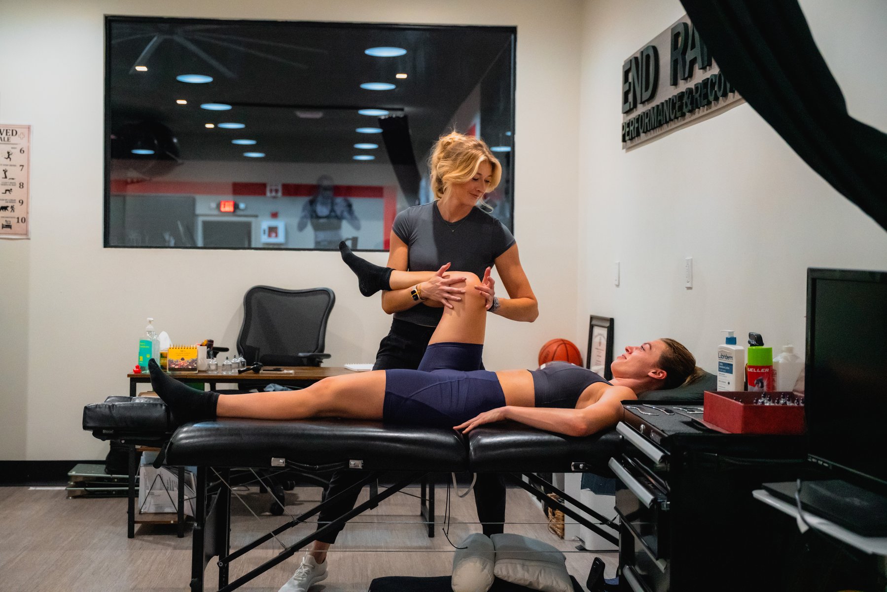 Dr. Lindsey Meeks providing one-on-one physical therapy at End Range Performance and Recovery